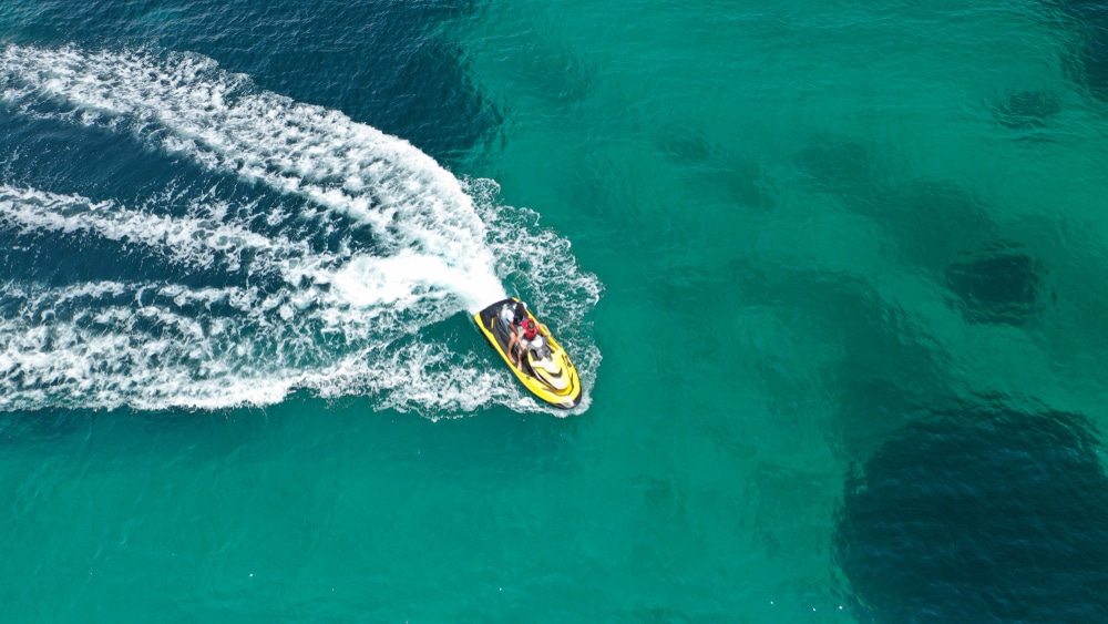 Jet ski underway on open water for PWC insurance risk review