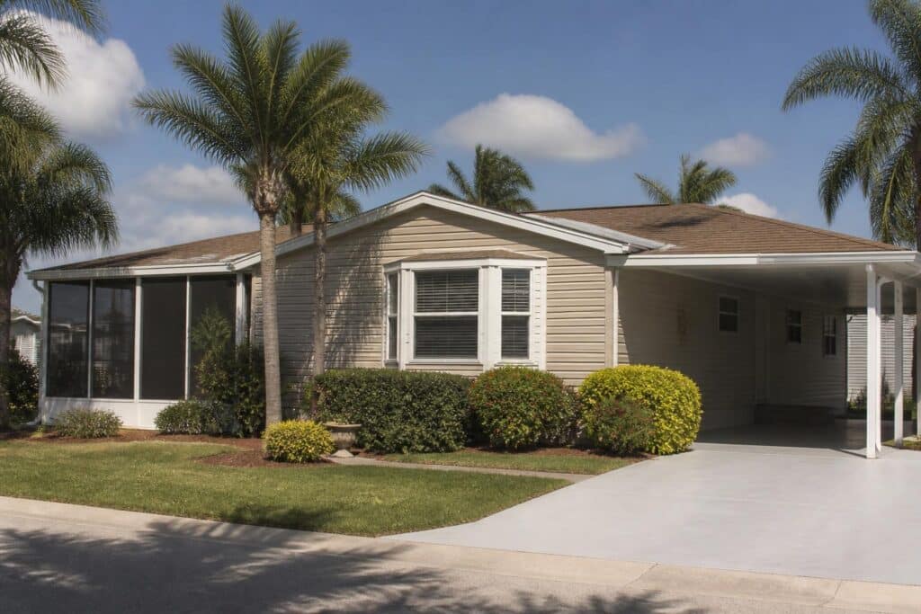 A well-maintained manufactured home with a clean shingle roof in Southwest Florida